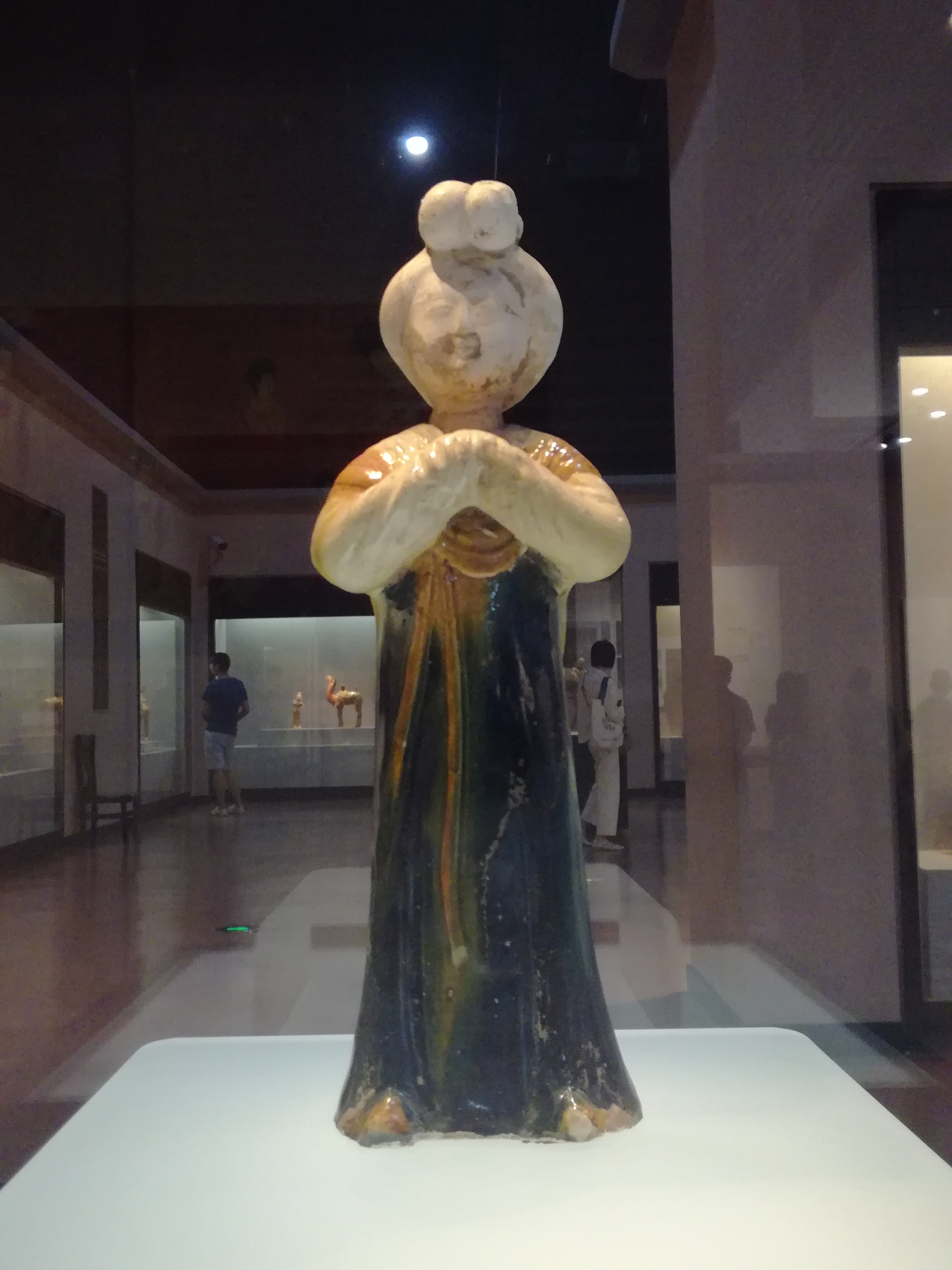 A large painted pottery figure of a court lady, Tang dynasty