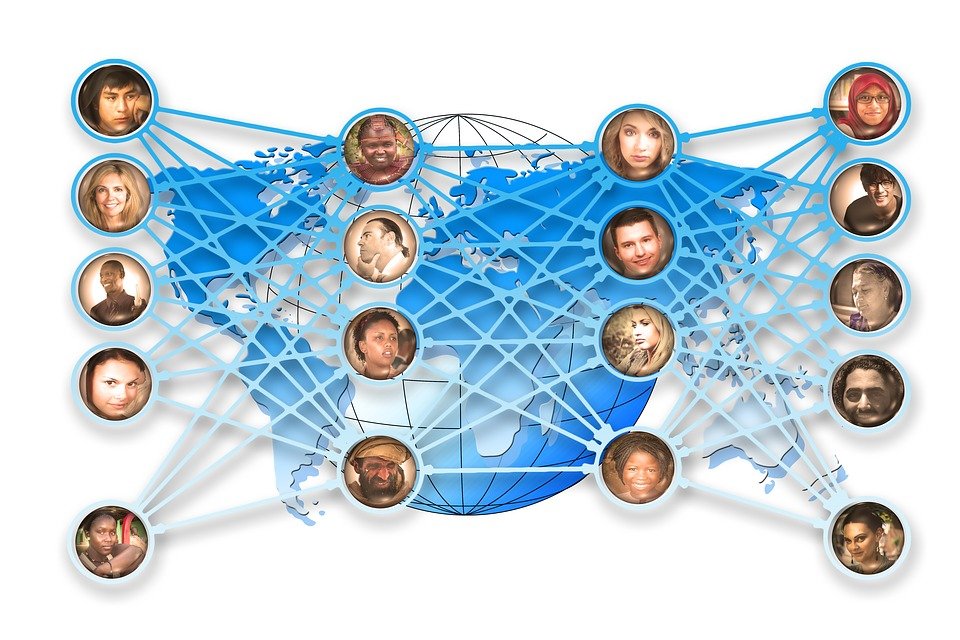 World map behind a chart of people of various ethnicities being connected