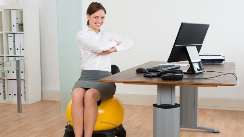 8 Exercises You Can Do While Sitting At Your Desk