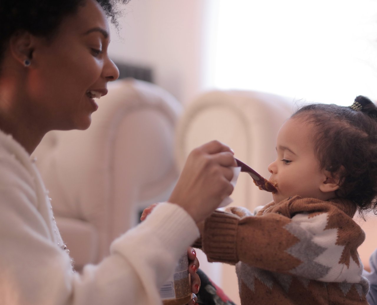 photo-of-woman-feeding-her-child-3820131.jpg