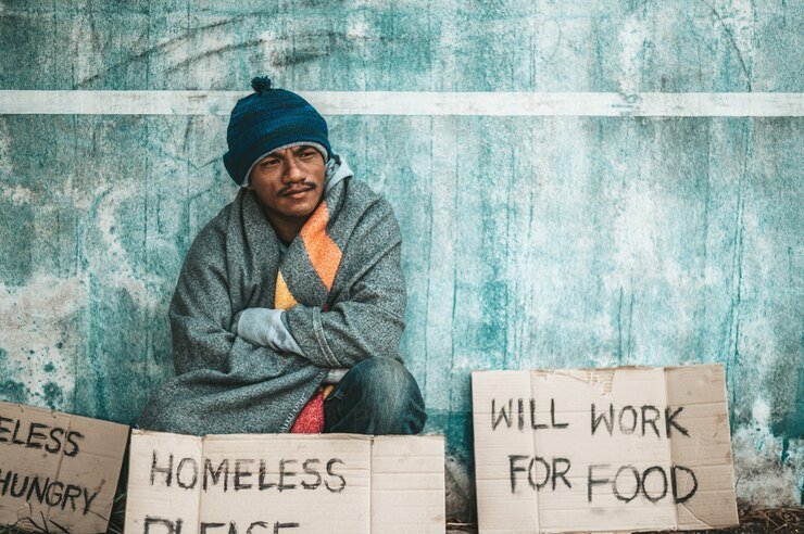 beggars-sat-beside-street-with-homeless-message-please-help-work-with-food_1150-22973.jpg