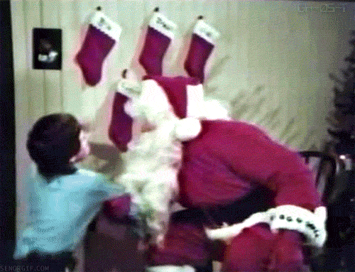 Funny-Christmas-Animated-GIF-Kid-Punching-Santa.gif
