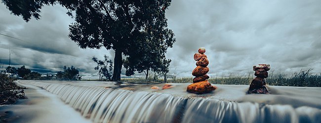 stack-zen-stones-waterfall-clouds-storm-background-large.jpg