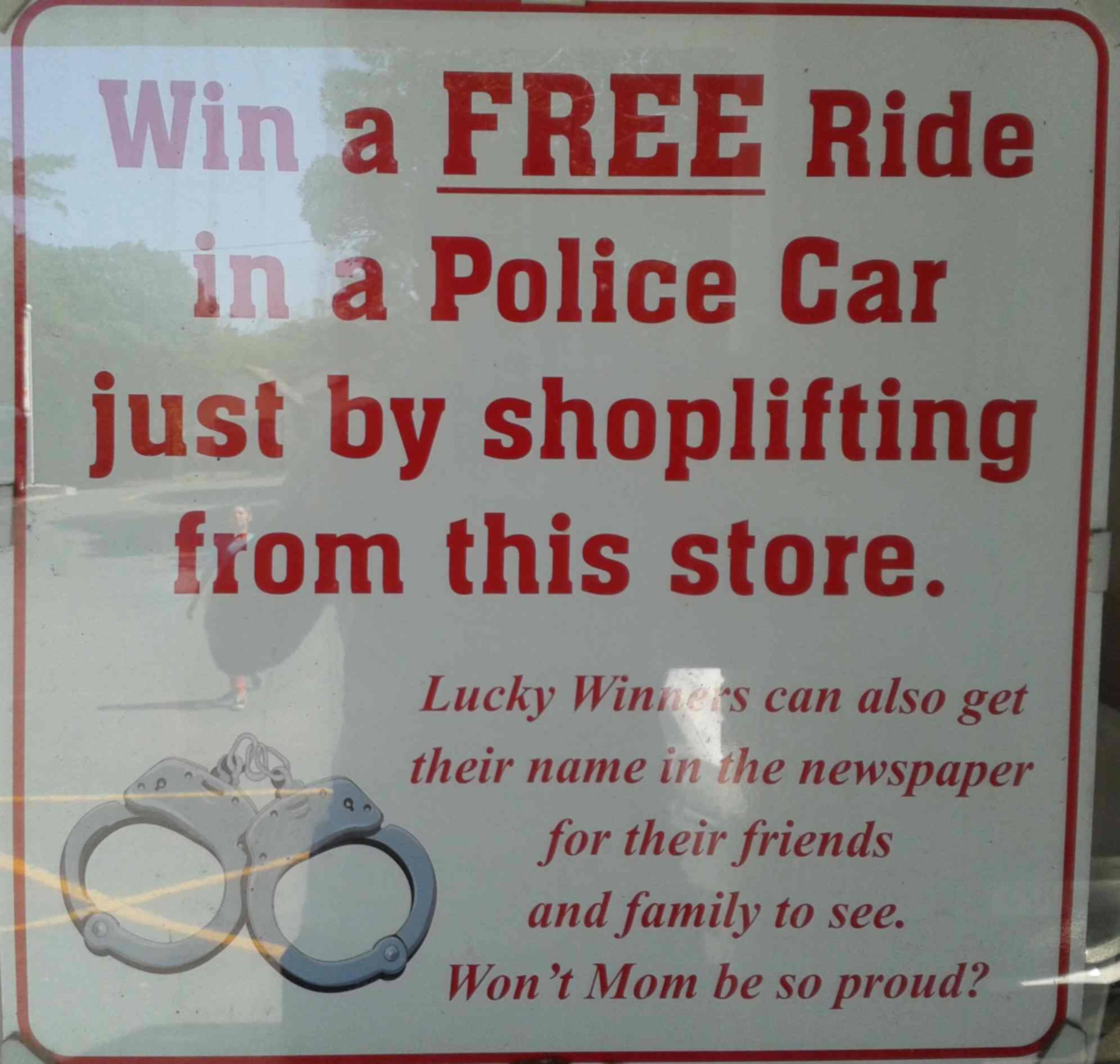FUNNY SIGN WIN A FREE RIDE IN A POLICE CAR BY SHOPLIFTING FROM THIS SHOP