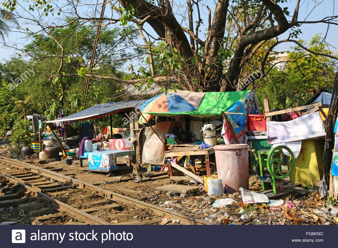houses-beside-the-railway-tracks-yangon-myanmar-FG6KNC (1).jpg