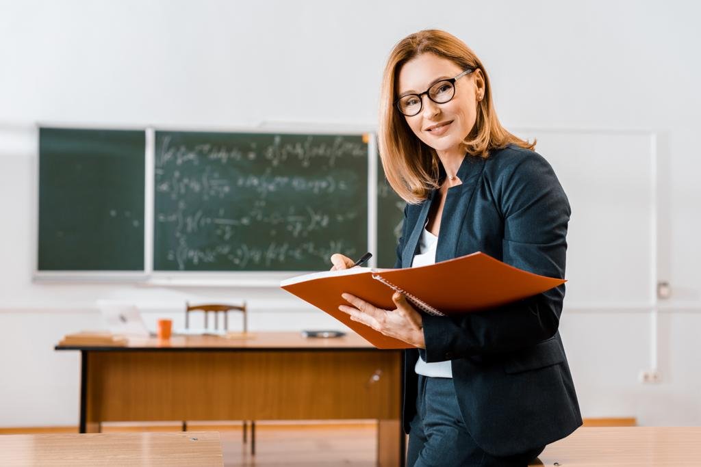 stock-photo-beautiful-female-teacher-formal-wear.jpg