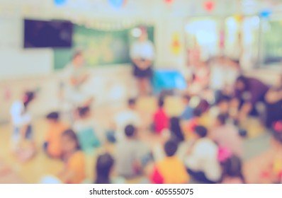 blur-kids-teacher-classroom-background-260nw-605555075.jpg
