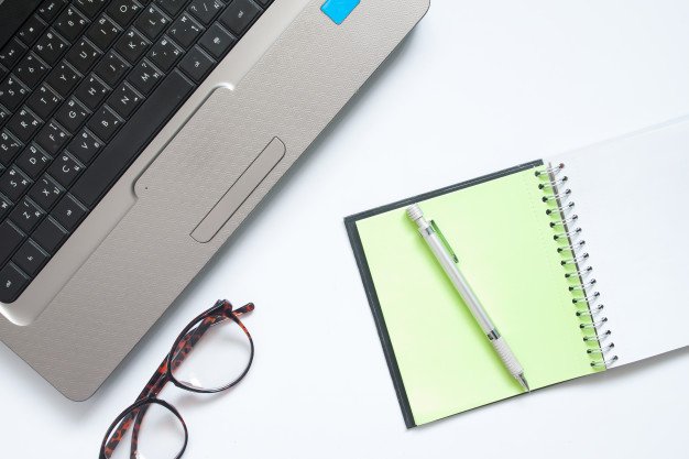 laptop-computer-eyewear-and-notebook-with-pen-workplace-on-white-background_1428-1621.jpg