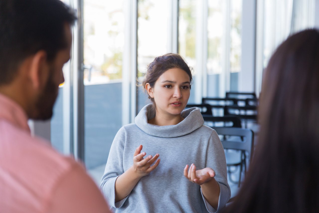 exciting-young-female-entrepreneur-discussing-startup.jpg