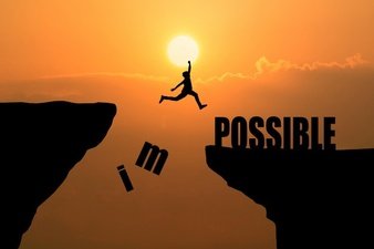 man-jumping-over-impossible-or-possible-over-cliff-on-sunset-background-business-concept-idea_1323-266.jpg