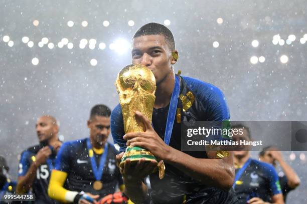 moscow-russia-kylian-mbappe-of-france-celebrates-with-the-world-cup-trophy-following-the-2018.jpg