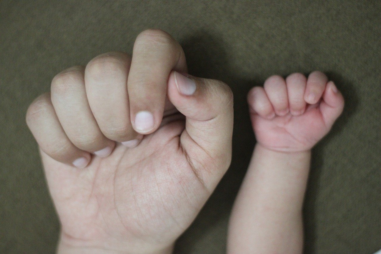 adult and baby hand.jpg