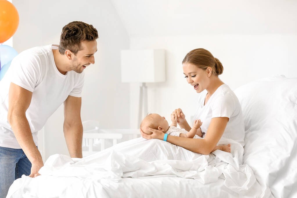 stock-photo-young-family-with-newborn-baby.jpg