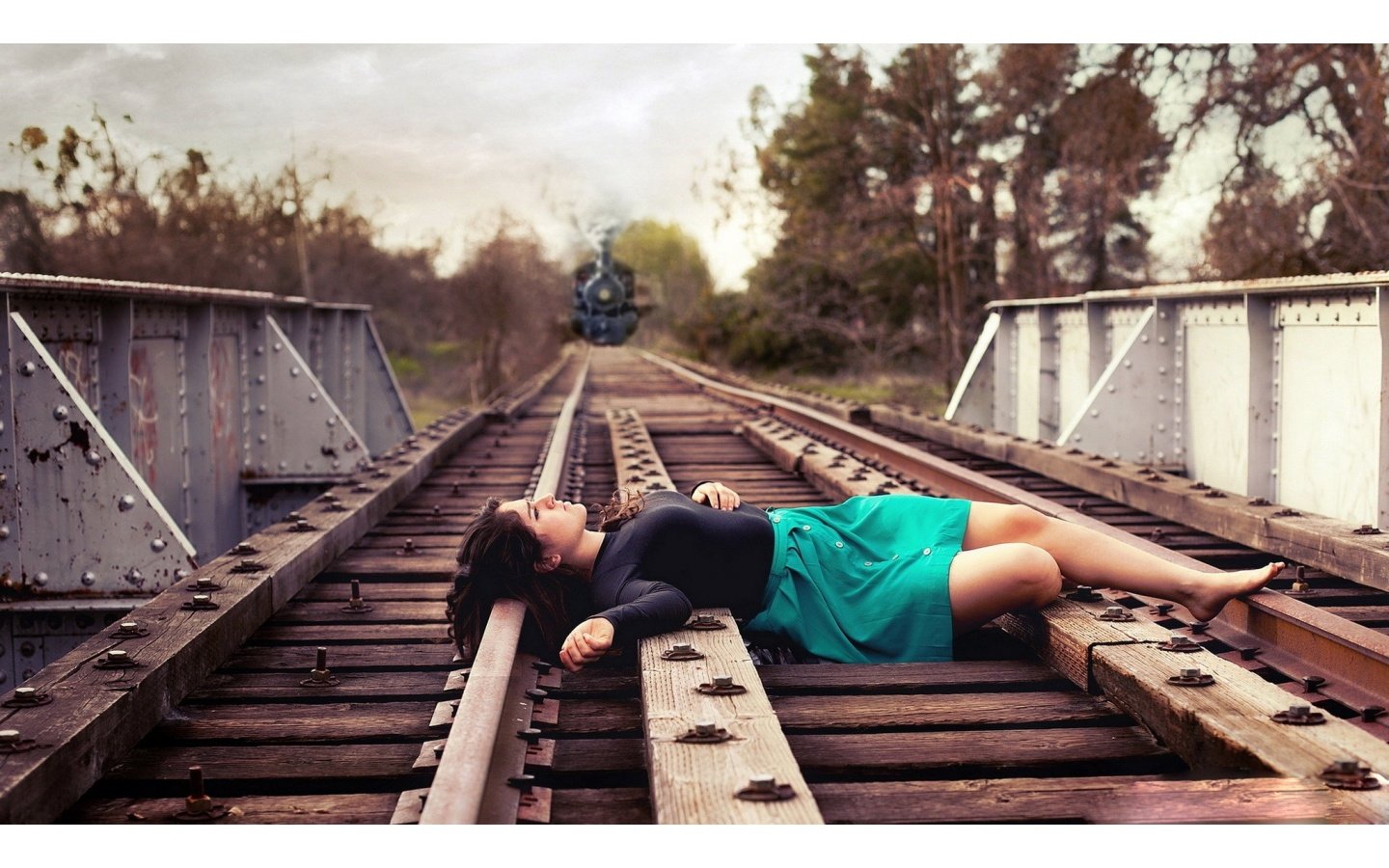 Woman, Infant Lay On Tracks "To Die". A Train Passes Over Them, But...