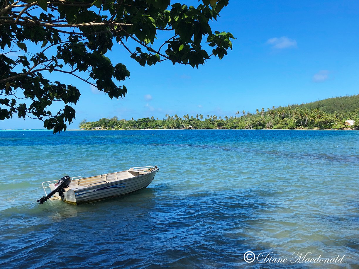 boat in lagoon parea huahine.jpg