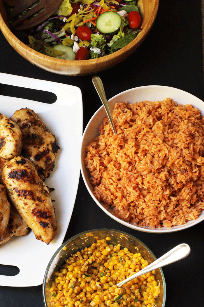 dinner-with-mexican-rice-chicken-corn-and-salad.gif