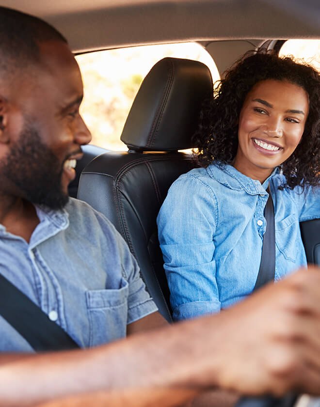 couple-smiling-at-eachother-in-car-swipe.jpg