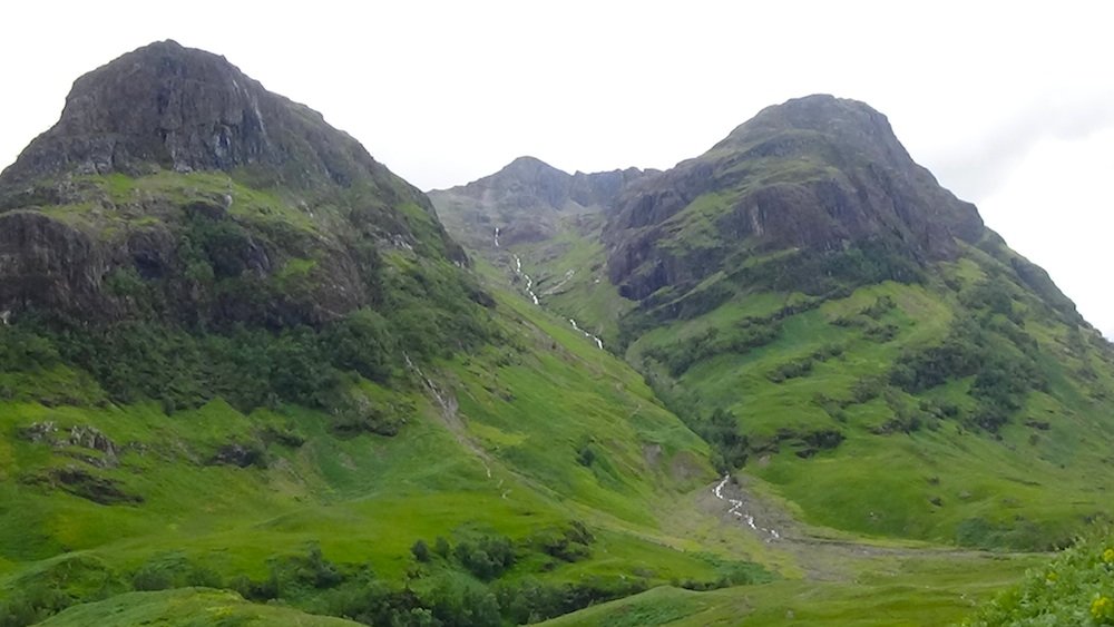 64 View up to two of the Three Sisters with the big long waterfall between them.jpg