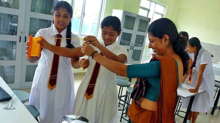 Students-Experimenting-with-Lab-Equipment-Benefiting-from-Free-Education-in-Sri-Lanka.jpg