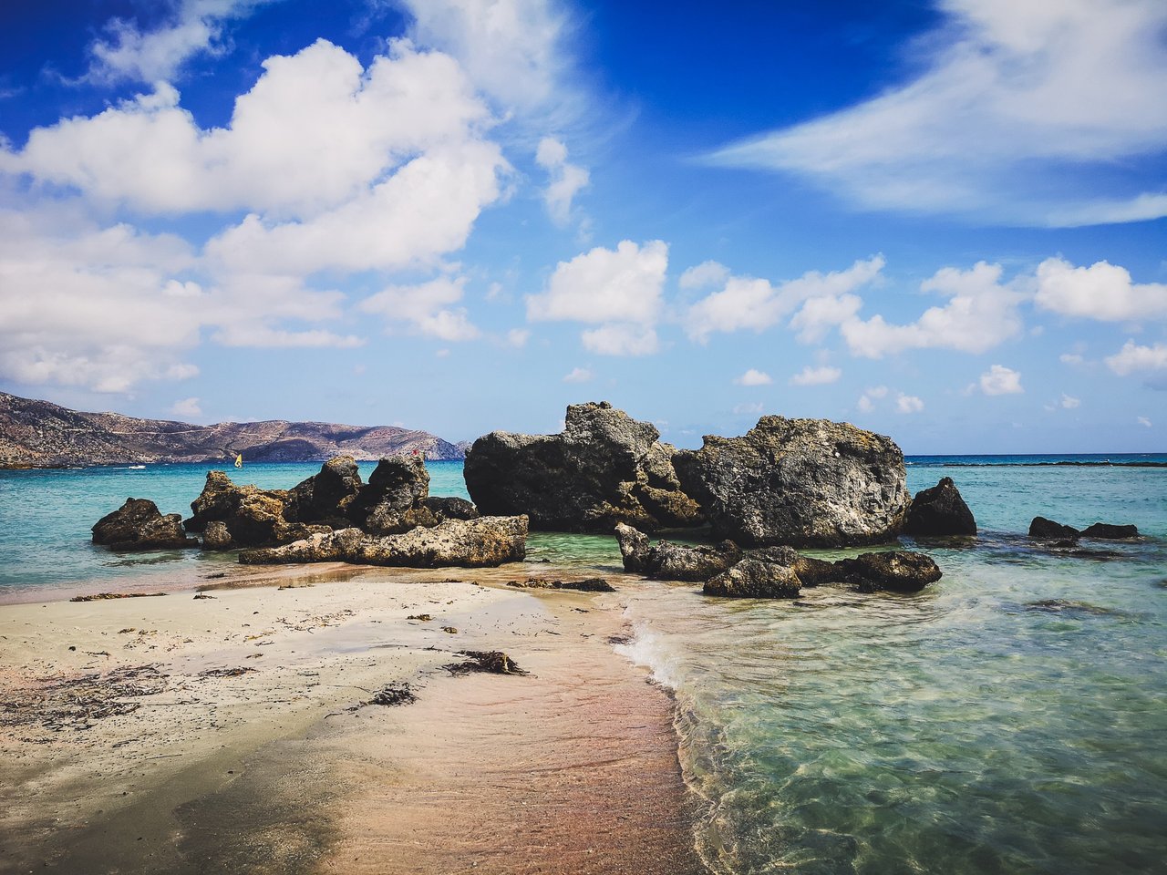 Purple sand and rocks of Elafonisi Beach, Crete Island