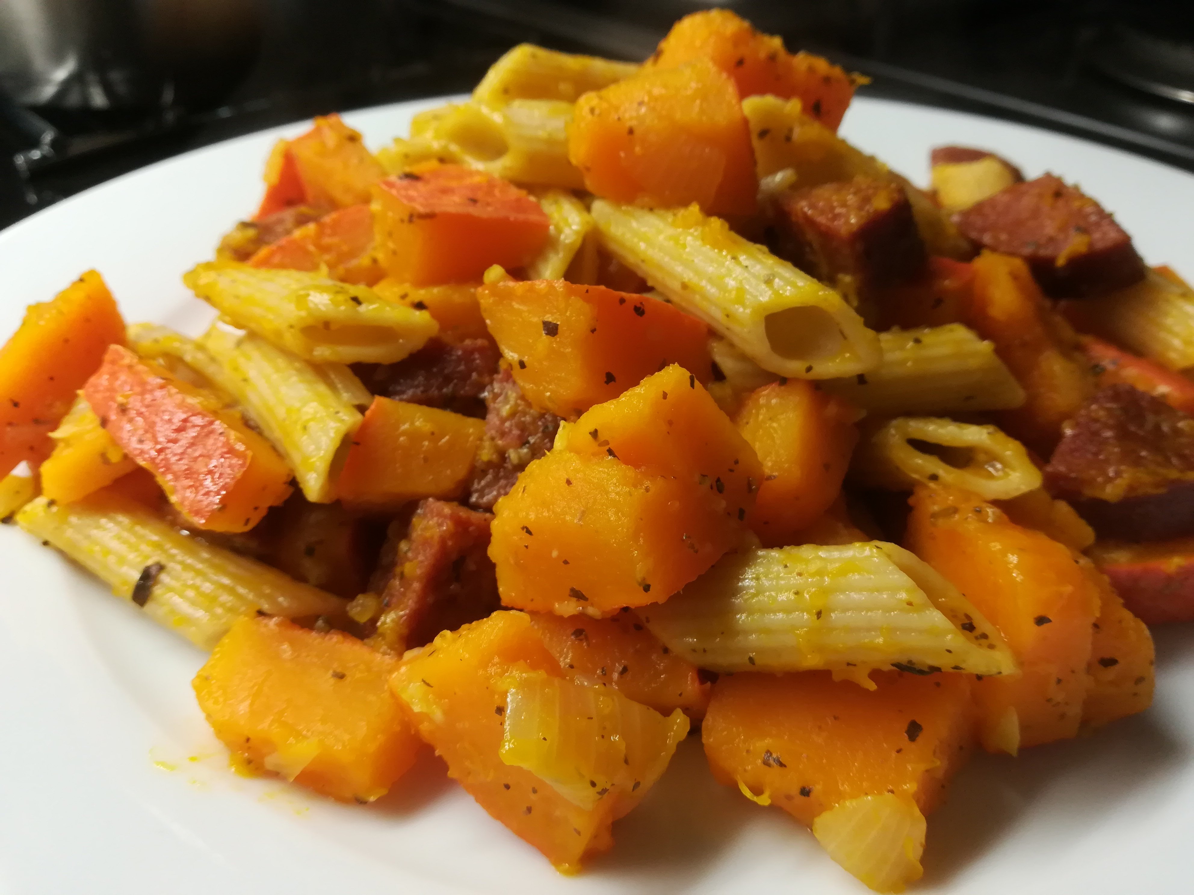 Pumpkin pasta with salami