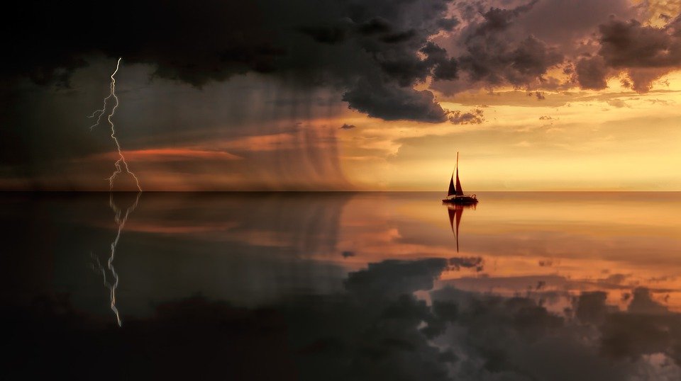 Sunset, storm and boat