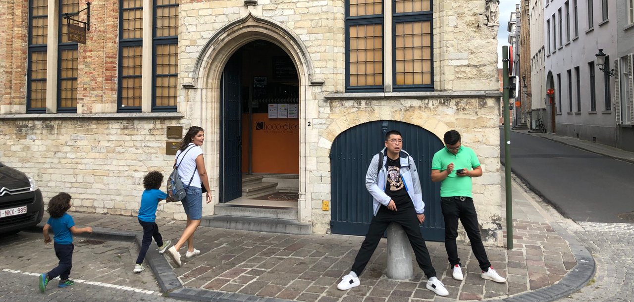 Entrance of Choco-Story Bruges.I don't know why this guy was posing like this, but it sure is very funny :)