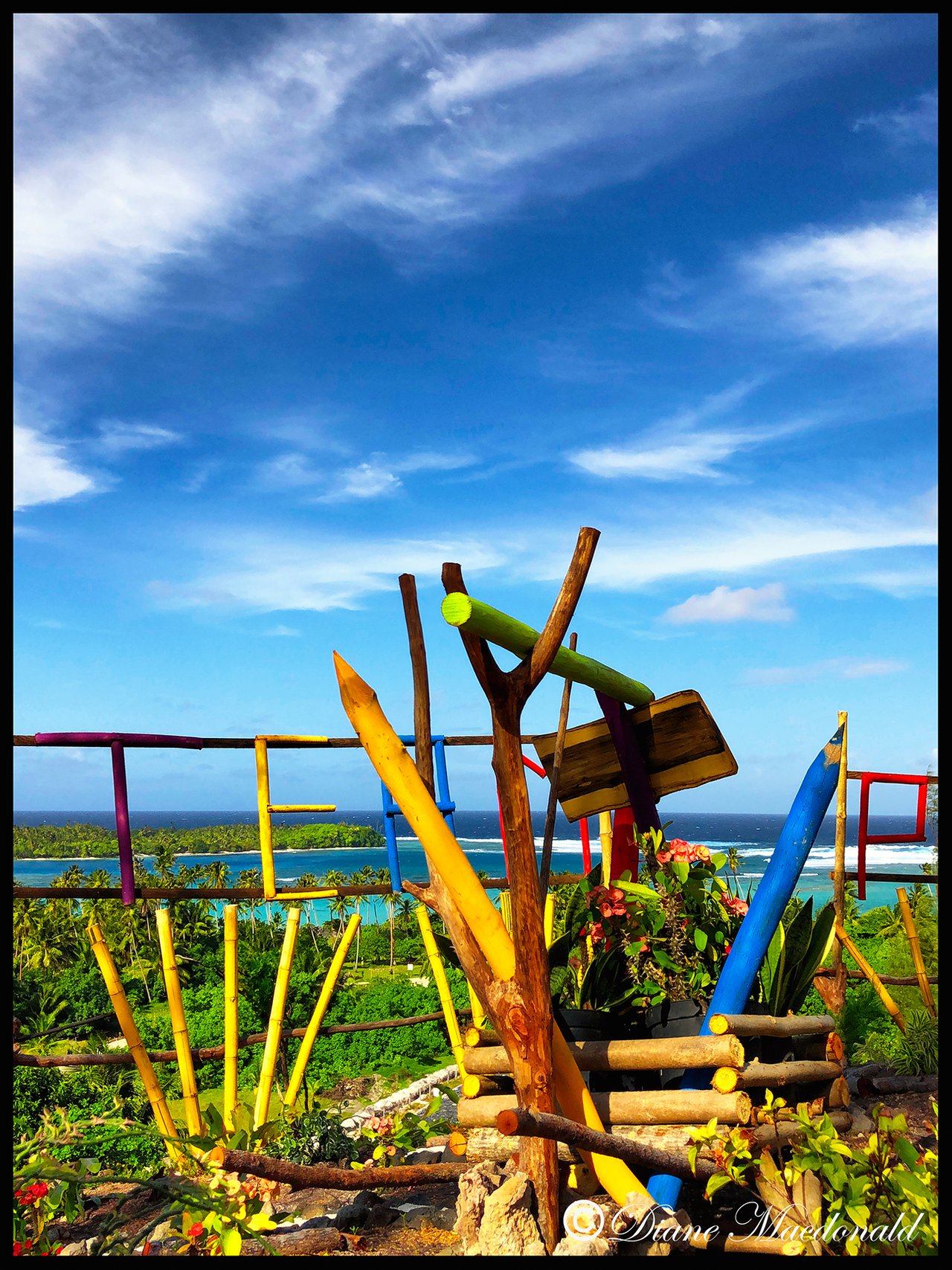 Carving of large coloring pencils on hilltop, Parea, Huahine