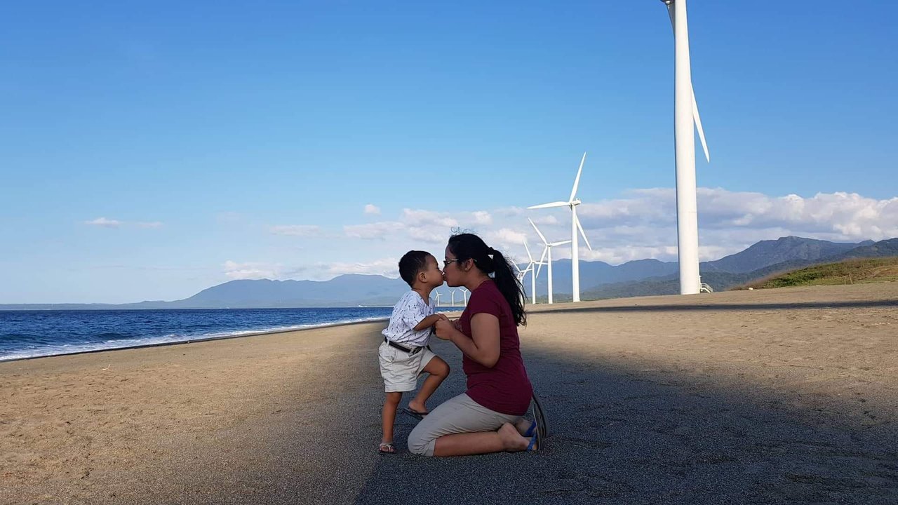 A creative pose with the majestic windmills