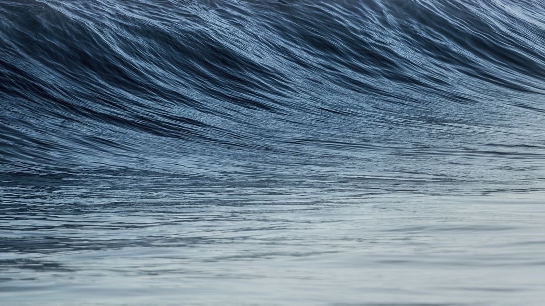 Waves were surging against the sea wall...