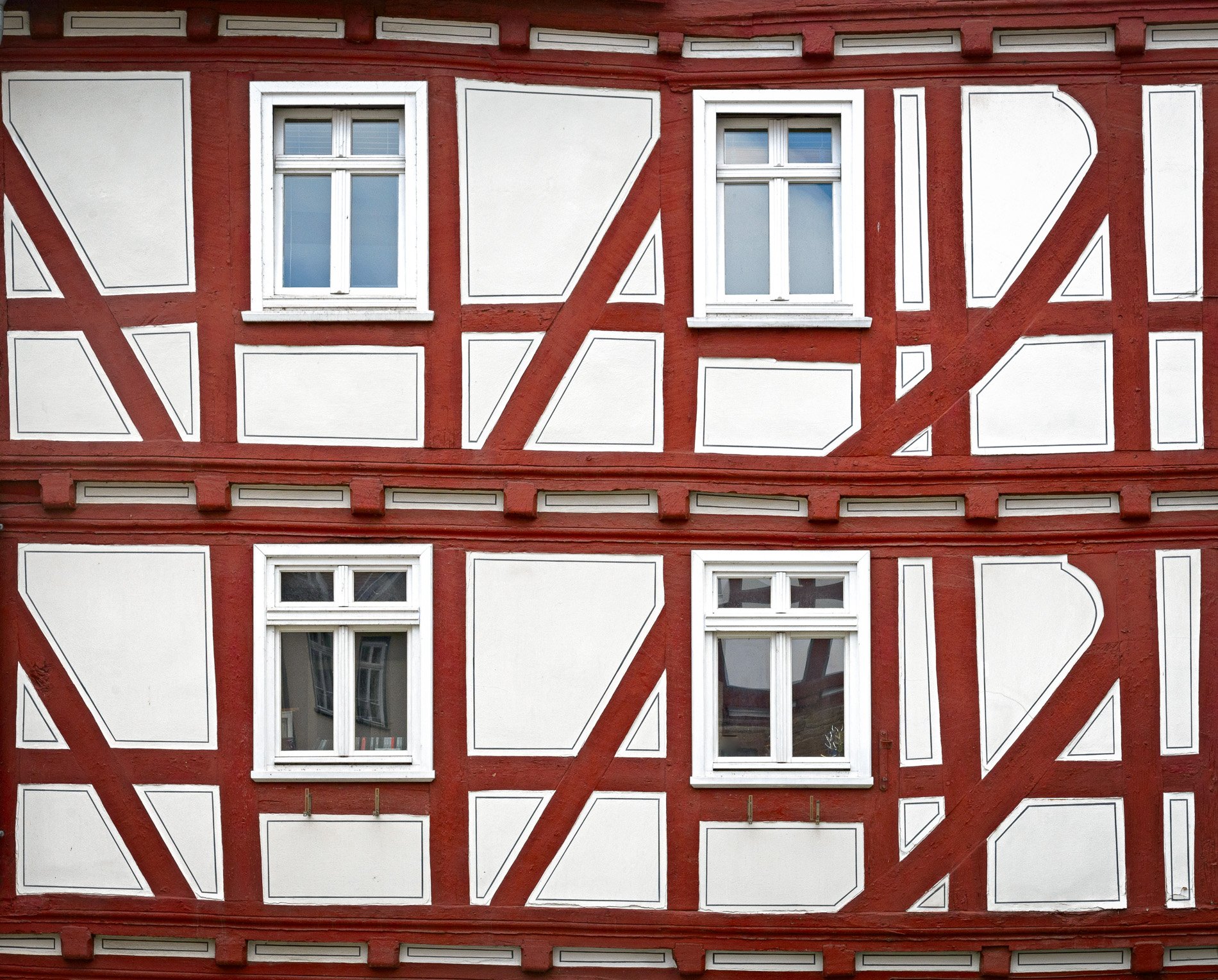 Four windows in a half timbered house