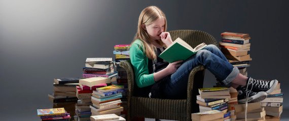 girl reading surrounded by books.jpg