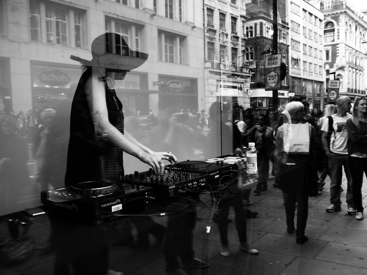 10236374797 - dj blonde ambition doing a set in a shop window bw.jpg