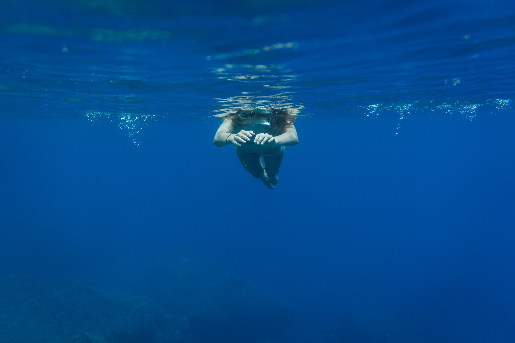 Tegan floating in the deep blue