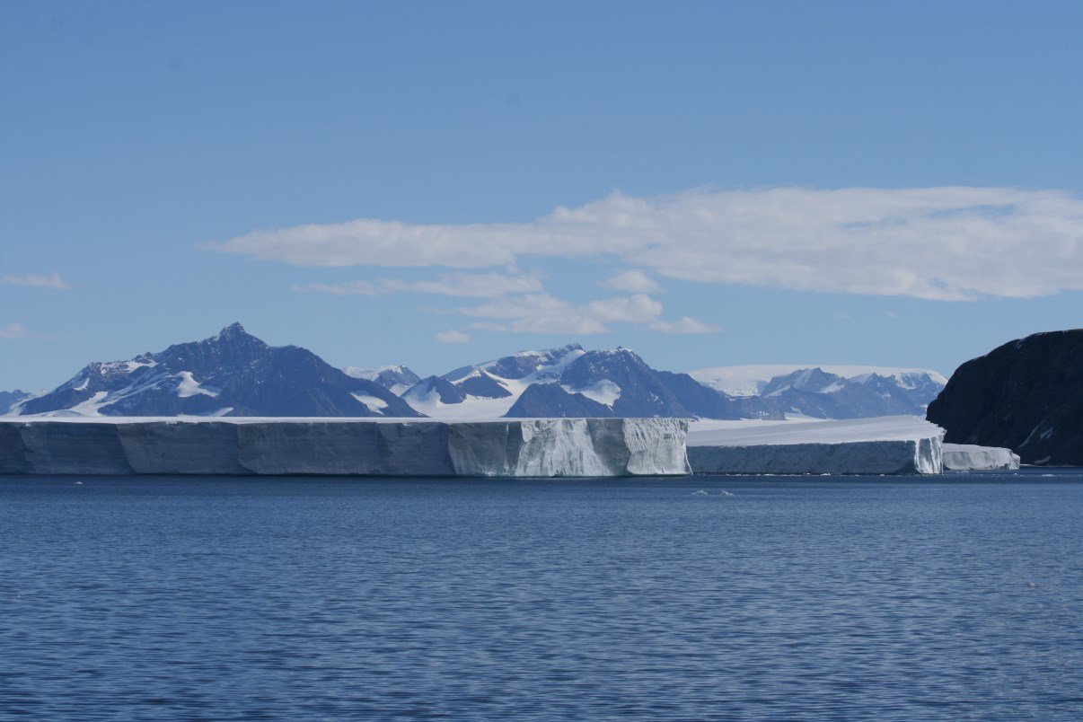 antarctica-ice-shelf-with-mountains-surrounding-it.jpg