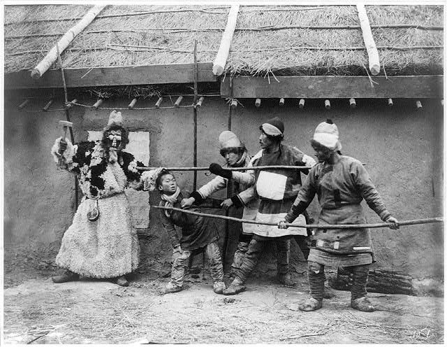 11-49-37-Goldi_tribesmen_acting_out_folk_drama,_"The_repulse_of_the_kidnapper"_LCCN2004707521.jpg