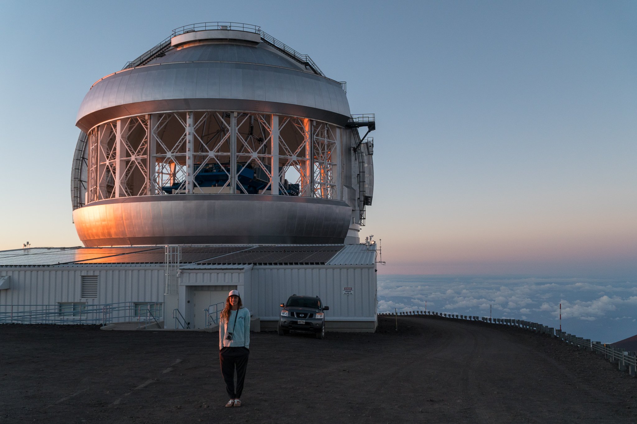 Tegan standing infront of an observatory