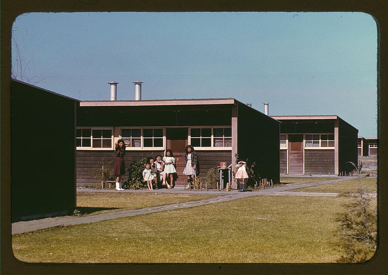 Familiesof_migrant workers in front of row_shelters FSA labor camp Robstown TX 1942.jpg