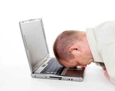 exhausted-man-head-on-computer-iStock_000003263575XSmall.jpg