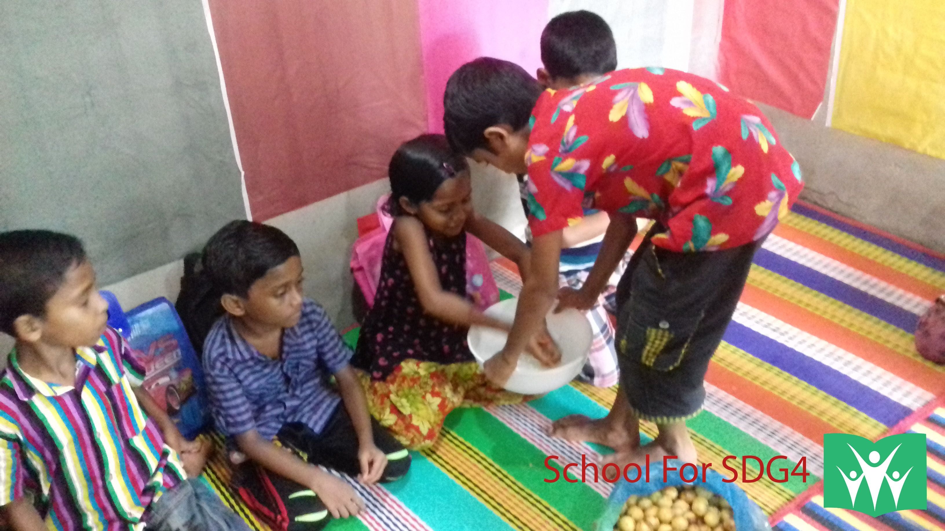 Kids Washing Hands before taking fruits.jpg