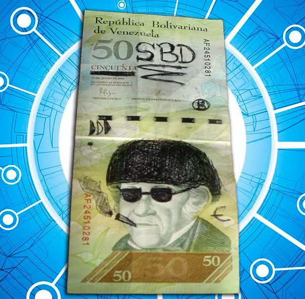 50 SBD billete con bolígrafo.jpg