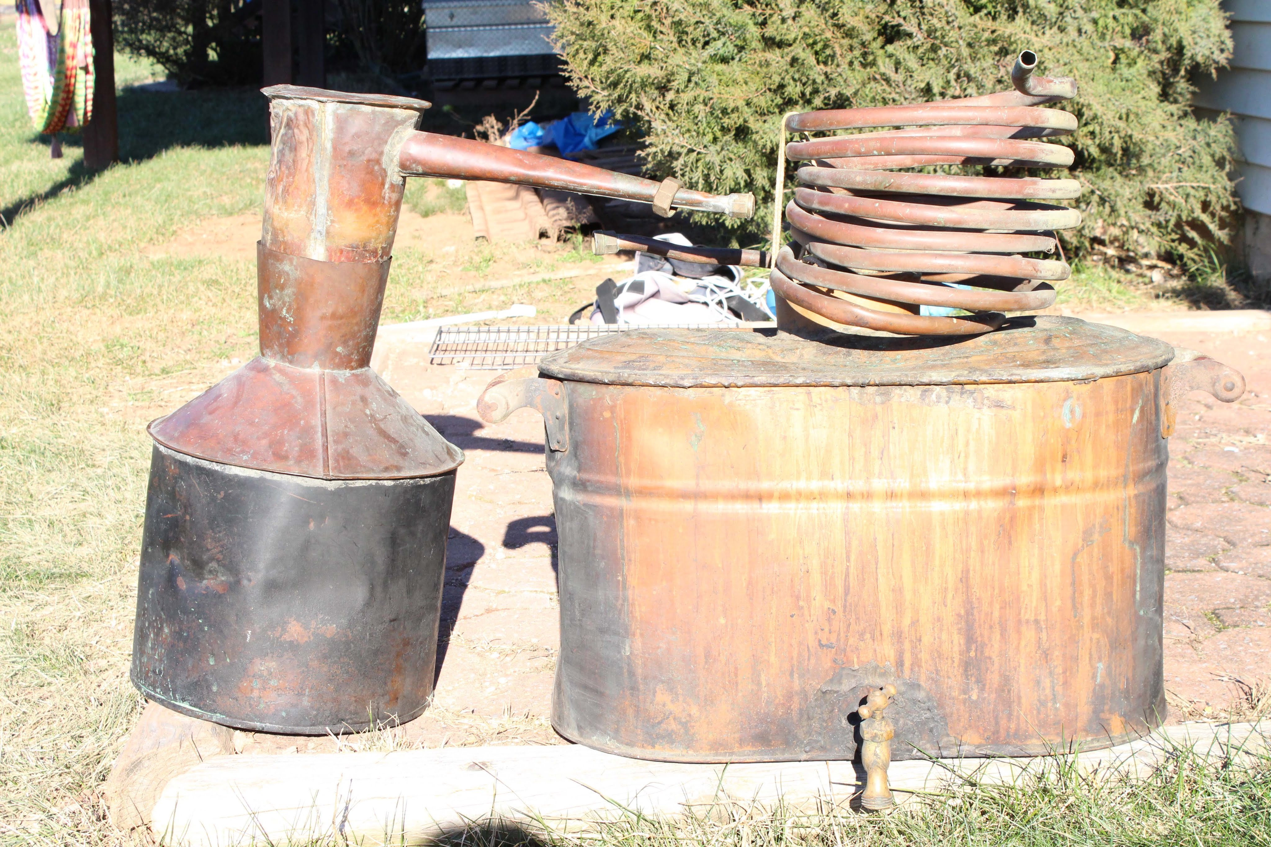 An Antique Copper Moonshine Still With Coil And Antique Moonshine An Antique Copper Moonshine Still With Coil And Antique Moonshine