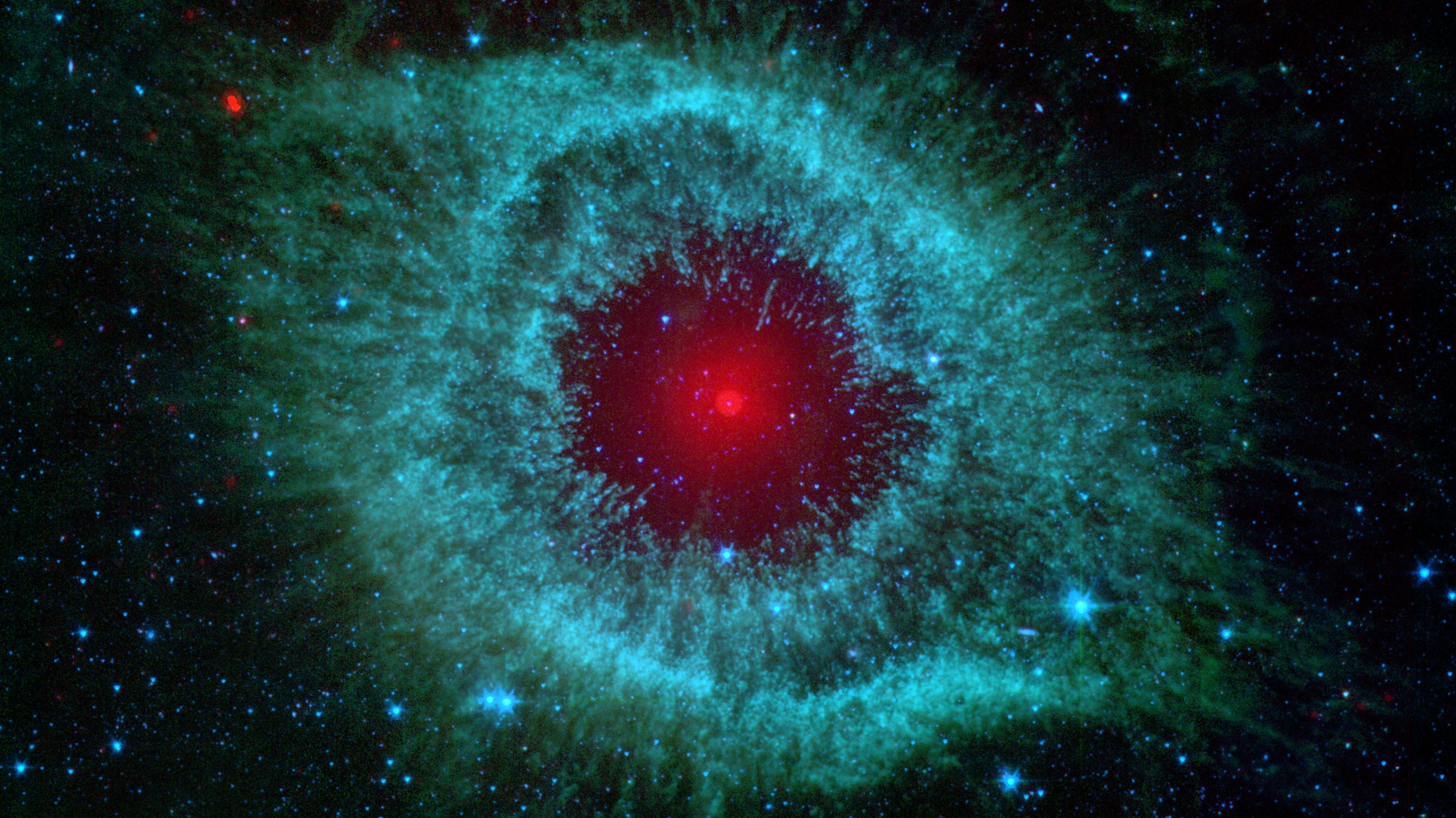 Comets_Kick_up_Dust_in_Helix_Nebula_%28PIA09178%29_Trimed_16-9.jpg