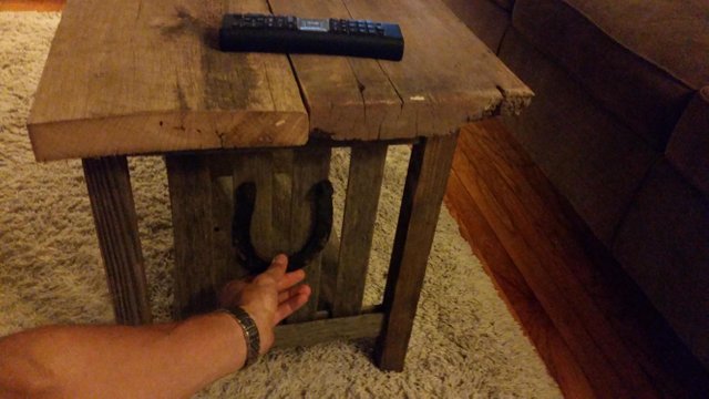 Coffee table with a horseshoe on the side