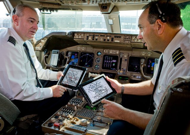 Picture of plane cockpit with pilots inside