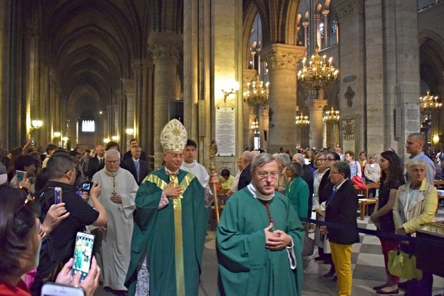 Notre-Dame priests leaving at end of Mass