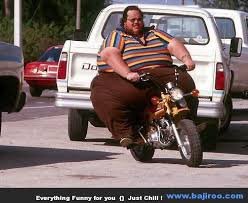 fat man on a motorbike