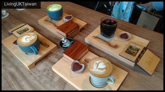 Four cups of coffee on a tray