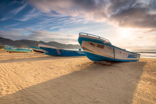 fishing boats at the shore of Puerto Lopez