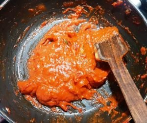 Keep stiring the tomato paste to avoid burning
